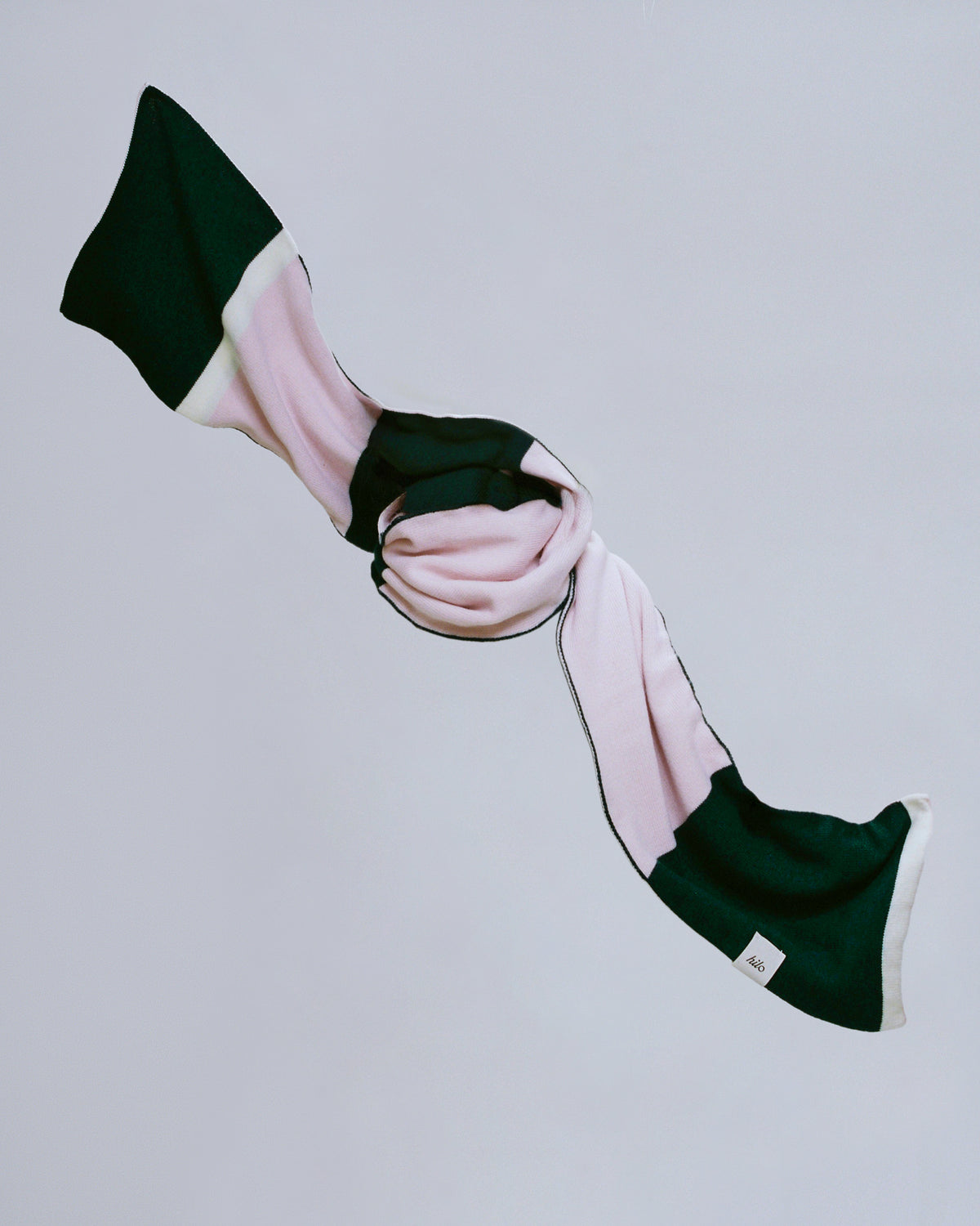 Amora Merino wool scarf, back view showing green and pink color-block